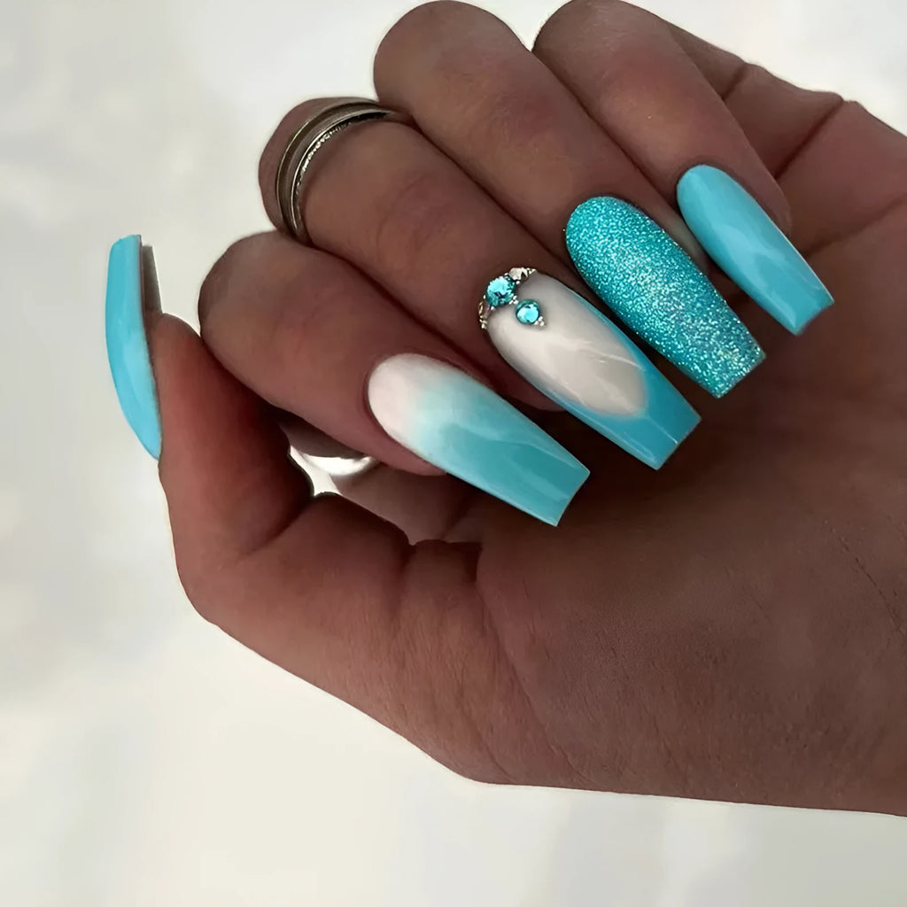 Solid colour long ballet nail art patch with smart blue diamond design on a nail, with glue bottle.