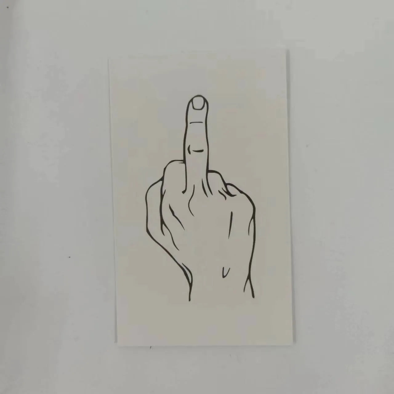 Illegal parking reminder card with middle finger design on paper with colour printing