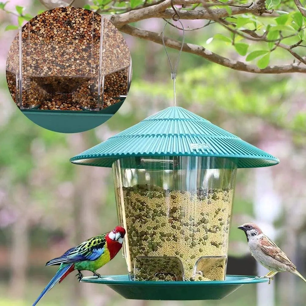 Outdoor garden hanging transparent bird feeder in green PP material with automatic feeding mechanism