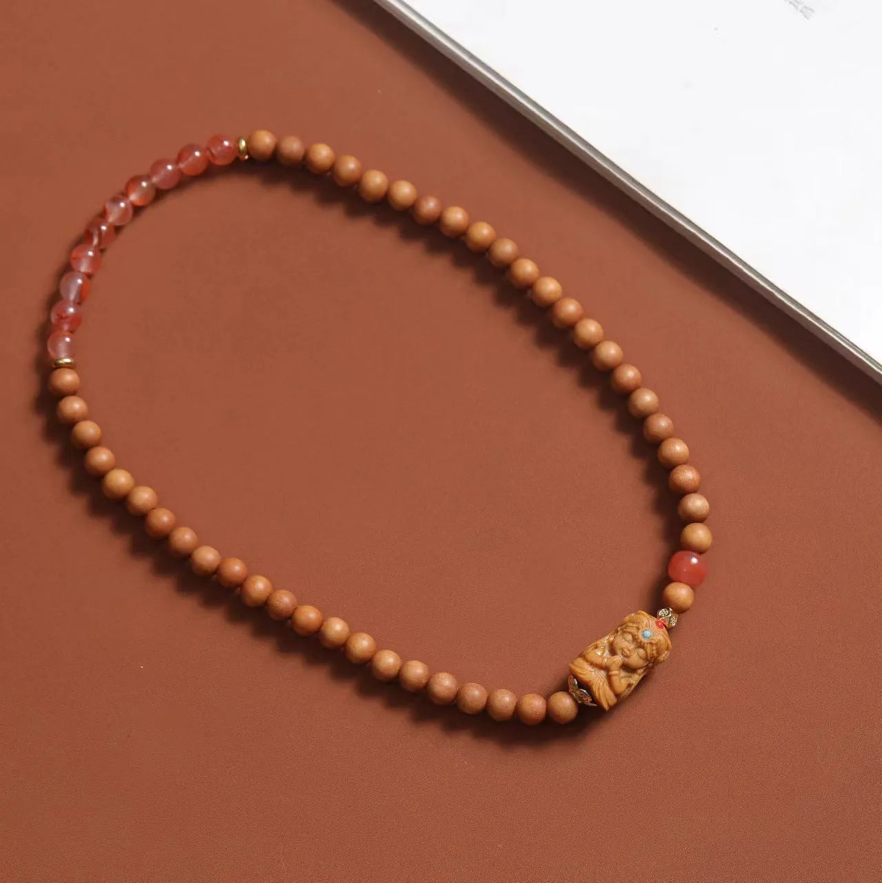 Brown woven wooden bracelet with 6mm round beads featuring South Red Zachilam and double circle design