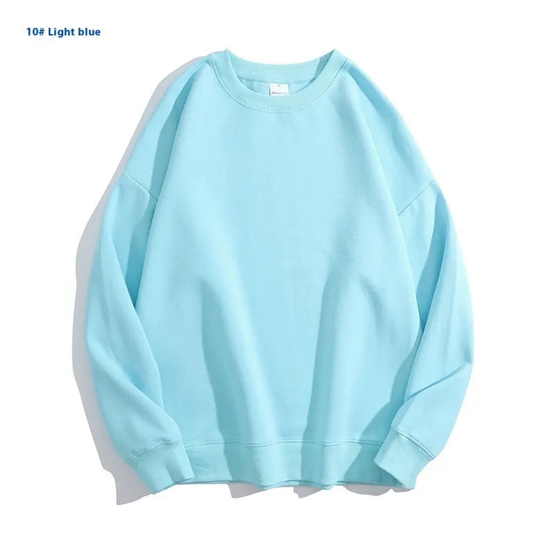 A woman's loose cotton off-shoulder sweater in a solid colour with long sleeves.