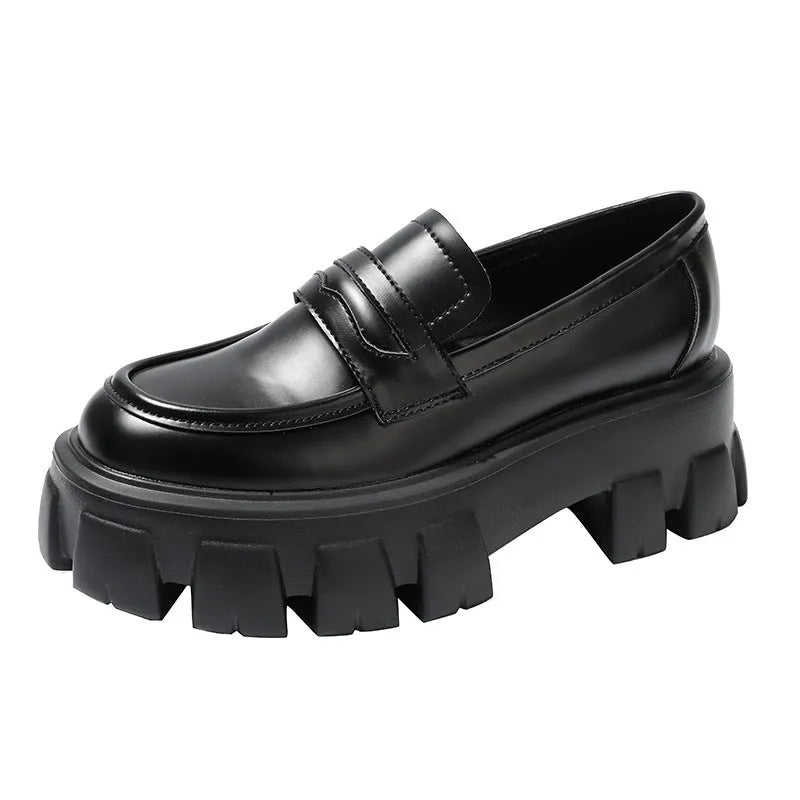 British style wide fit loafers in matte or patent leather with a rubber sole and muffin heel.