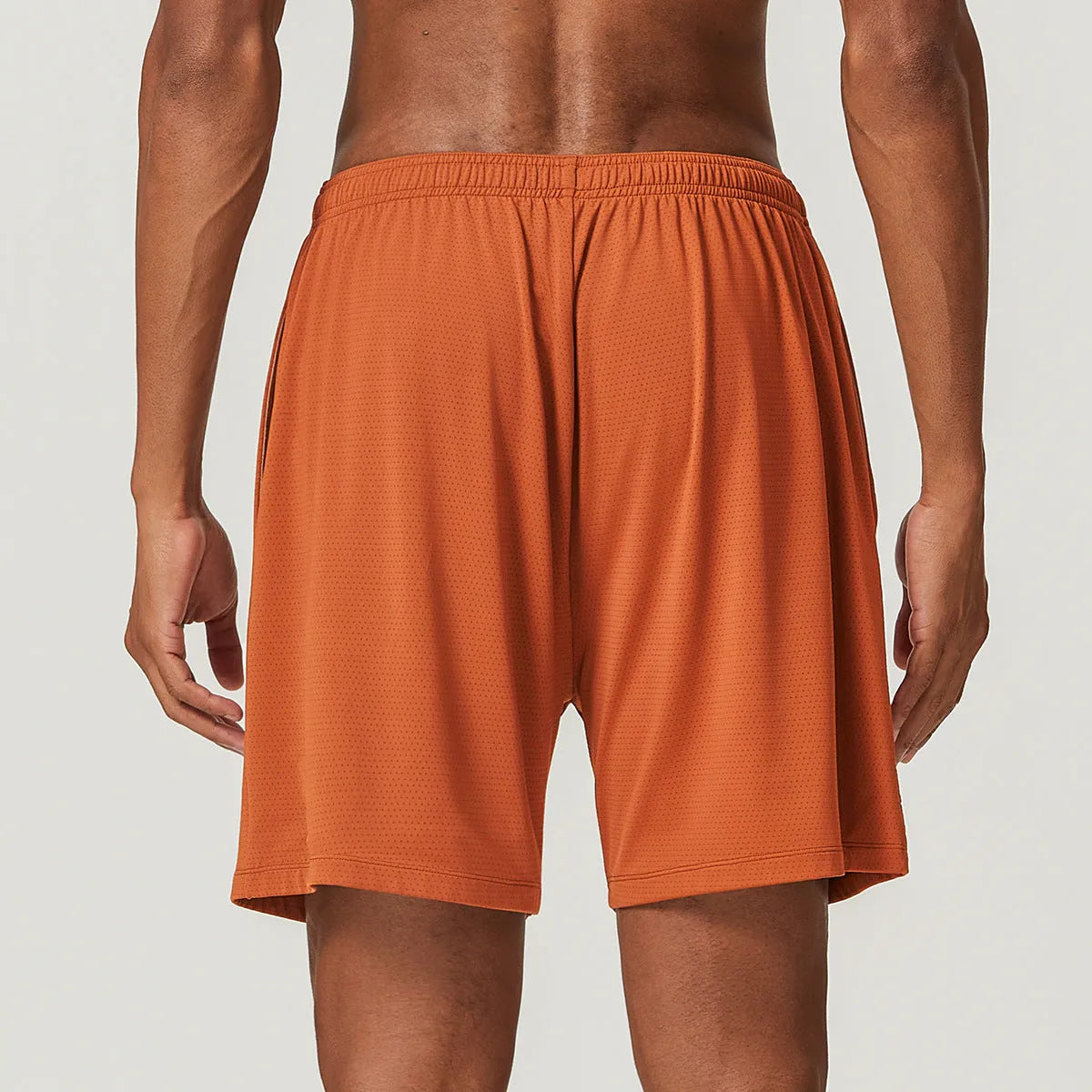 Men's double-layer quick-dry running shorts in sky green colour on a grey background