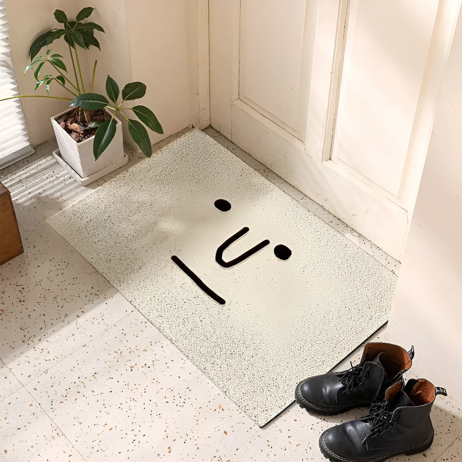 Square PVC floor mat with Mr. Big Nose cartoon face and geometric pattern, shown in available sizes.