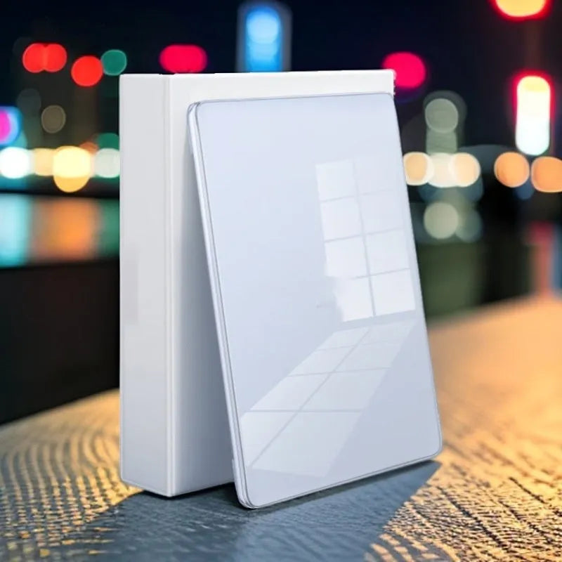 Transparent plastic protective shell for a MacBook laptop on a table.