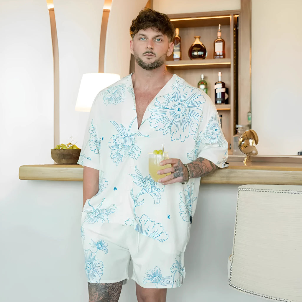A man's loose-fitting, short-sleeve printed cardigan in a light colour for summer.