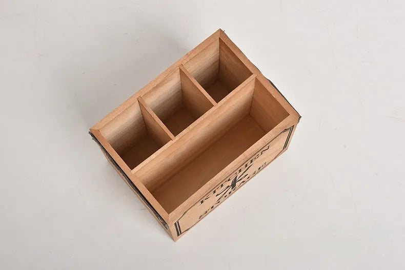 Wooden kitchen storage box with grid compartments for knives, forks, and chopsticks.