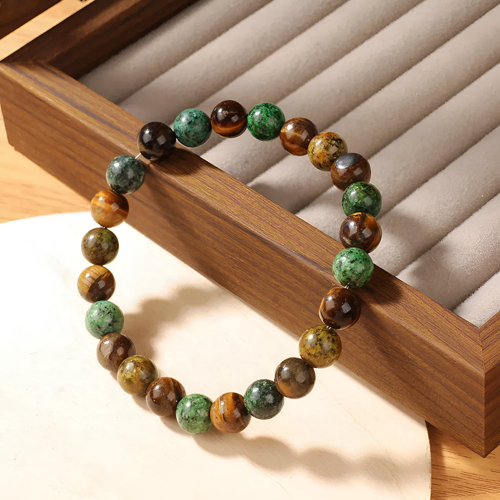 Tigereye natural stone fortune bracelet showing antique floral design and handmade construction