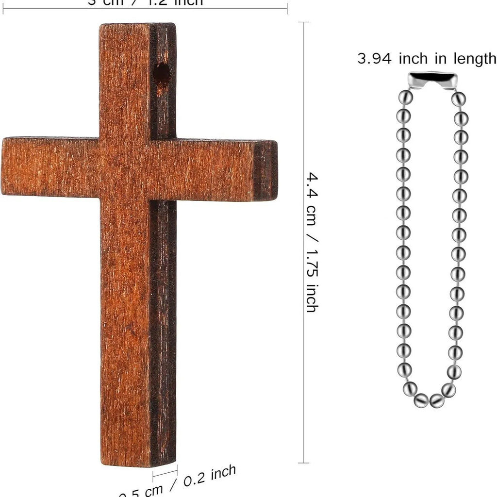 Wooden craft cross pendant ornament with natural wood finish, standing upright on a table