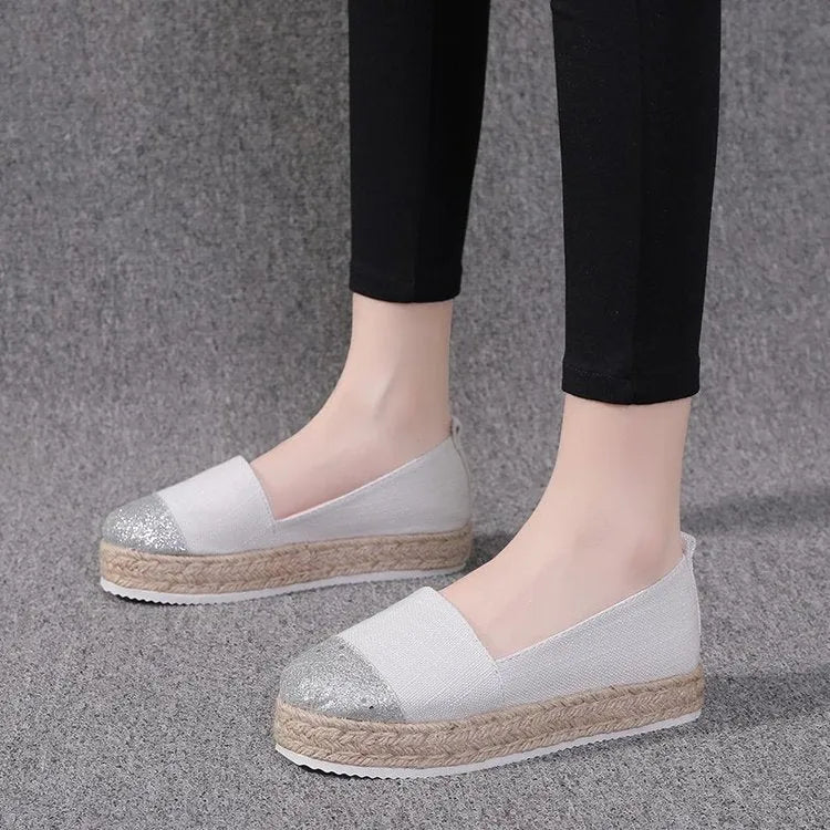 Plus size breathable canvas flat shoes in black and beige with round toe and slip-on design.