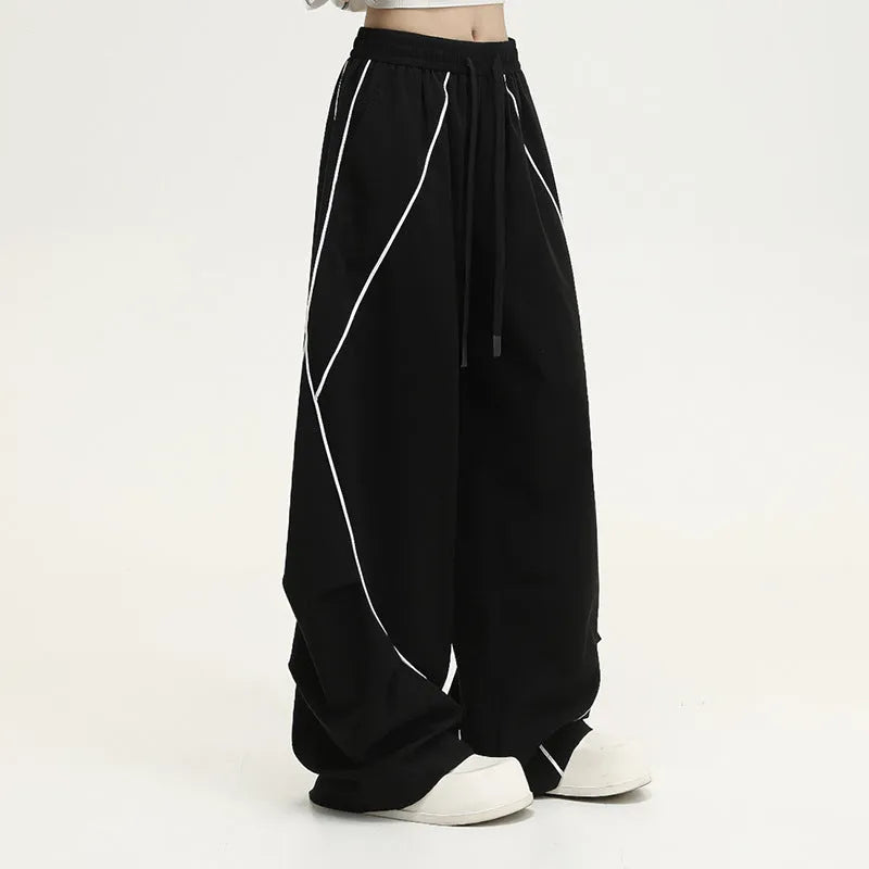 Black striped hip hop trousers with pleated wide-leg design for dance and casual wear