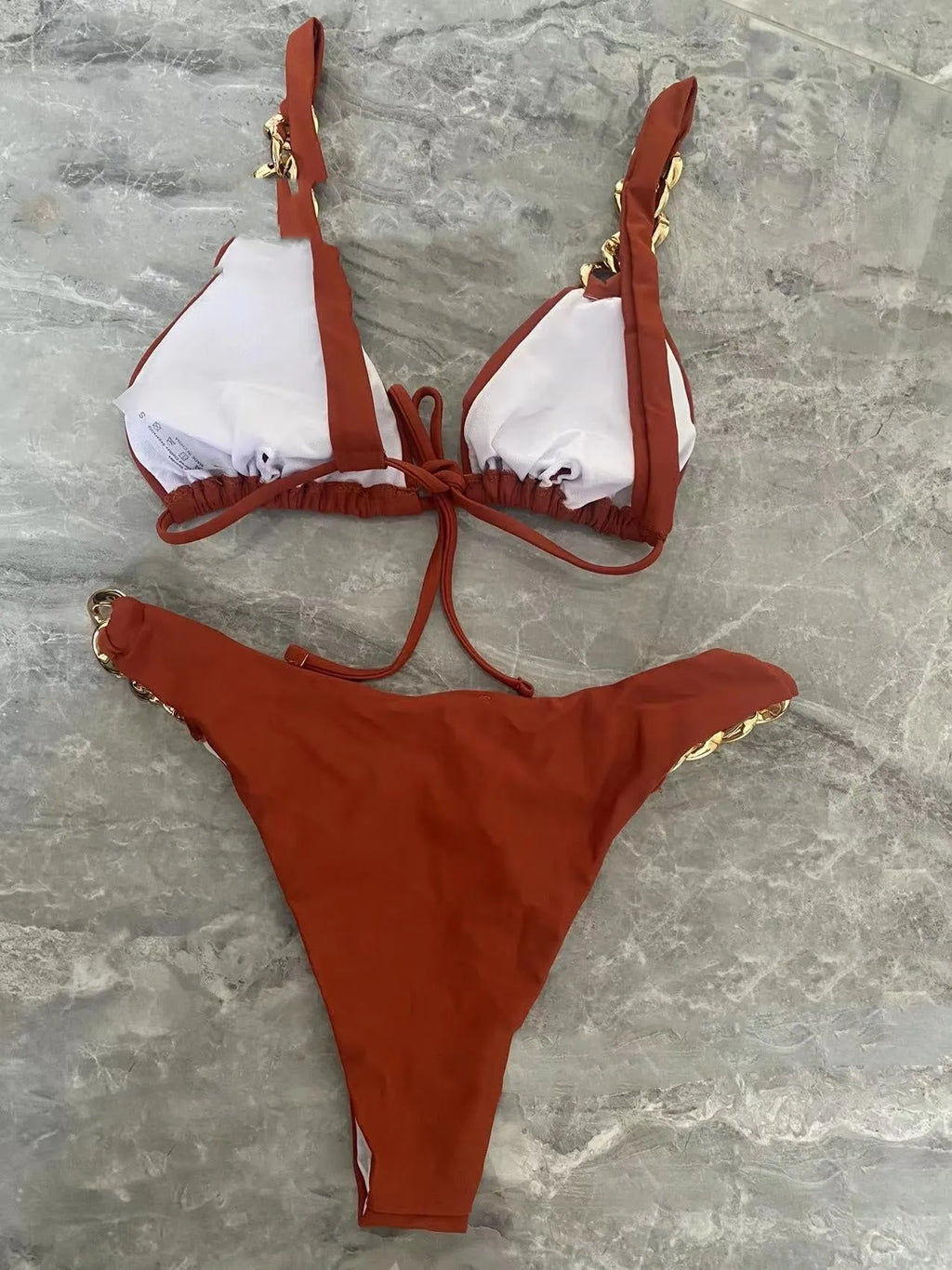 Brown women's tube-top bikini with adjustable halter neck strap and ring detail, shown with a split bottom.