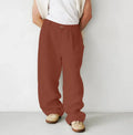 Men's loose linen jogger pants with high waist pleating and straight leg styling in multiple colour options