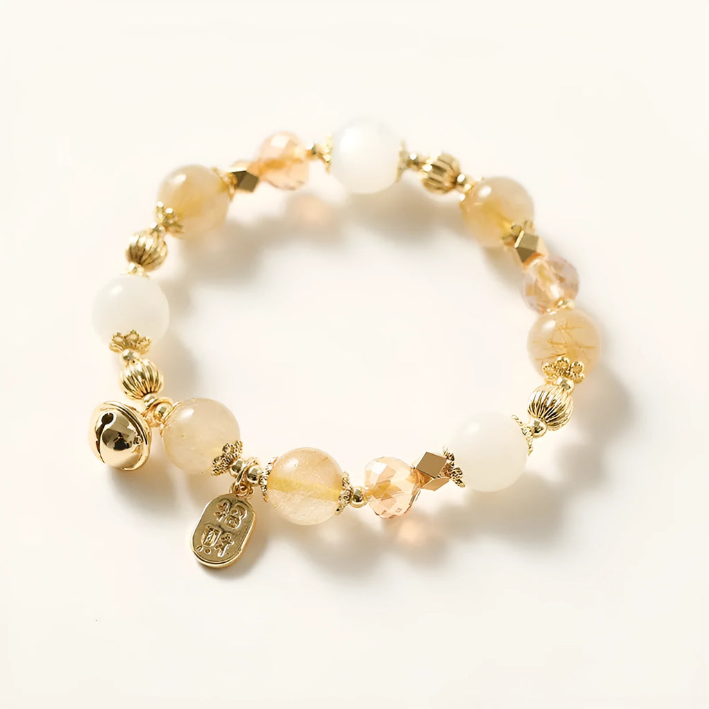 Gold tone rutilated quartz crystal bracelet with electroplated finish and Korean style design