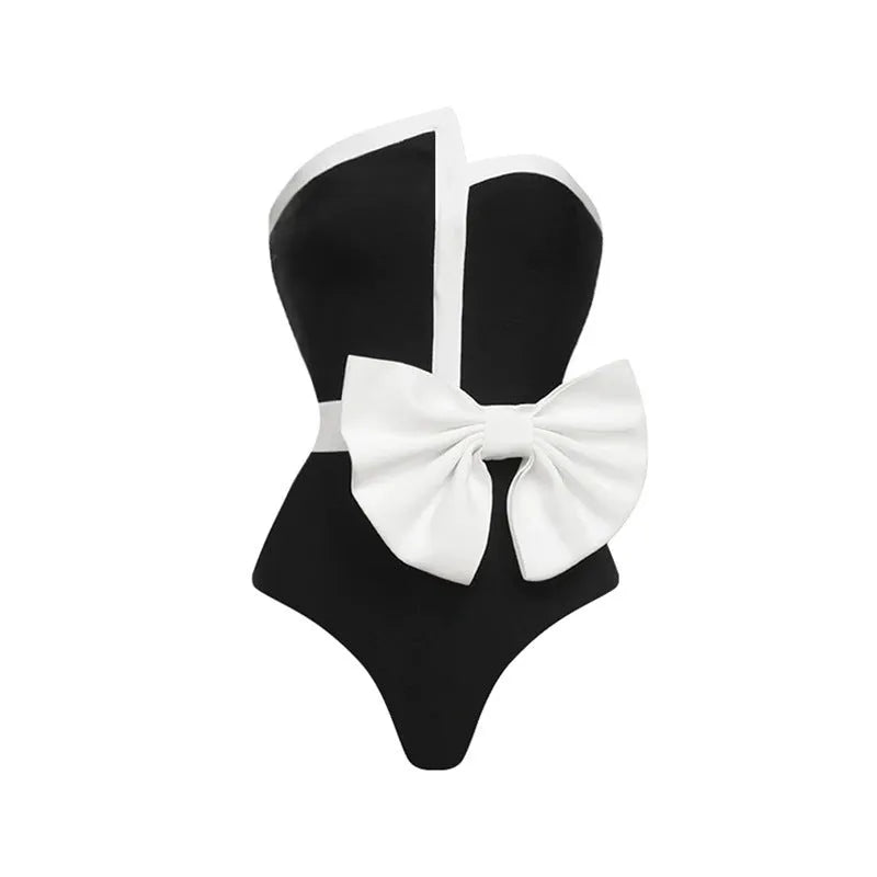 Women's black and white colour-blocking swimsuit with asymmetrical bow detail and tube top design