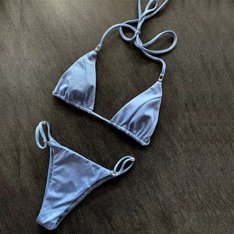 Women's nylon split bikini in red, backless triangle cut, on model at beach
