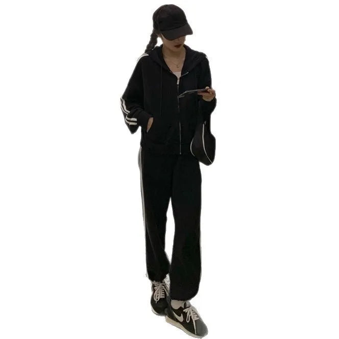 Women's two-piece striped polyester tracksuit set, light gray, top and trousers on plain background