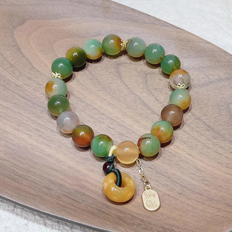 Women's peacock agate and topaz bracelet with a traditional peace buckle clasp.