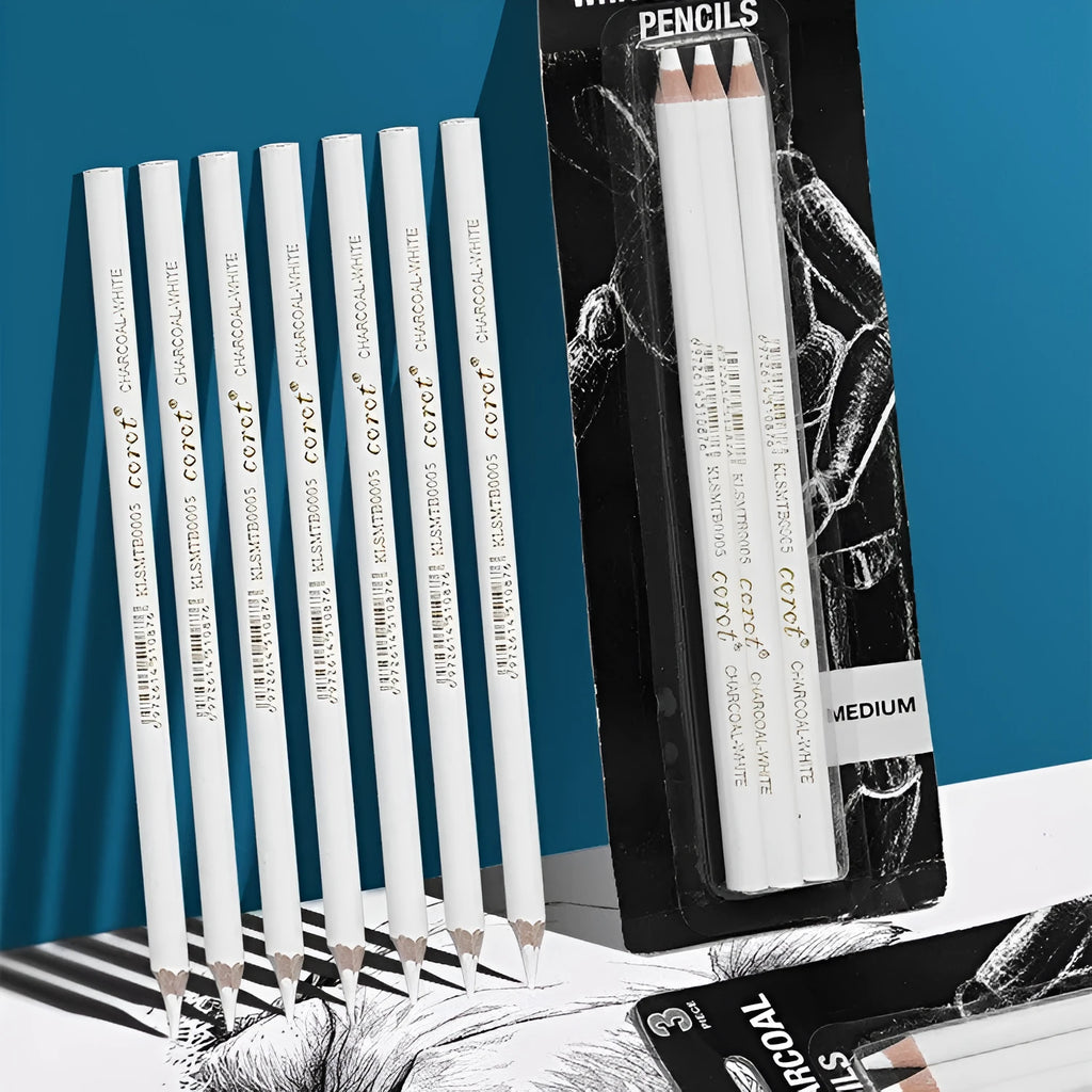 Set of three white charcoal sketching pencils in wooden casings.