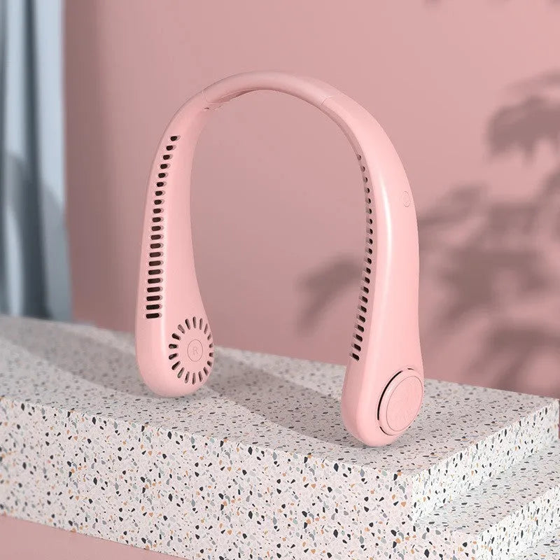 White portable bladeless neck fan being worn, showing its flexible band and streamlined air outlet.