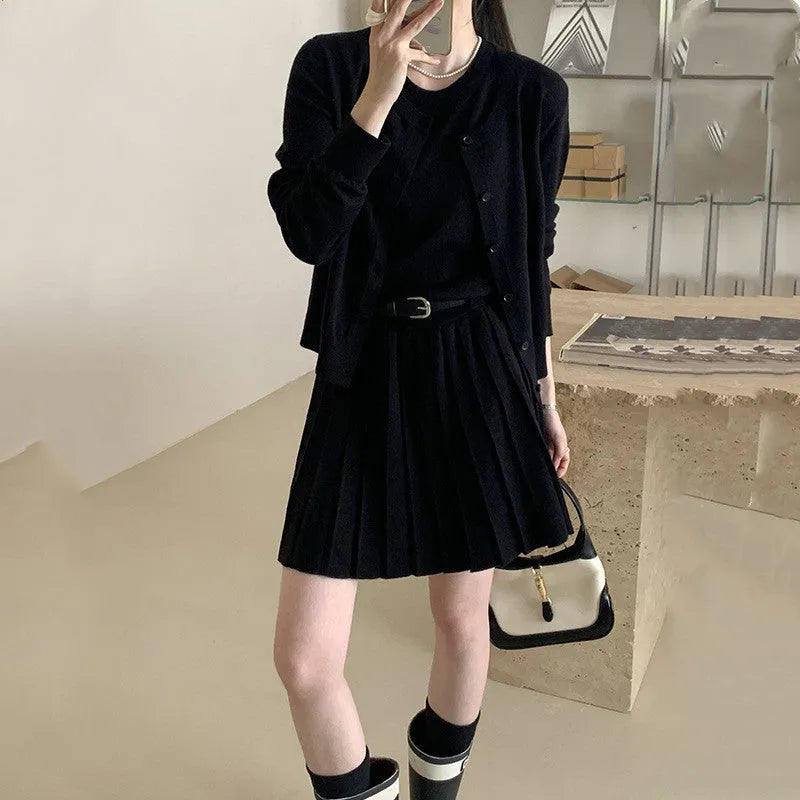 Women's grey art retro knitted two-piece set with pleated vest skirt, belt, and long sleeve cardigan featuring a 3D pattern.