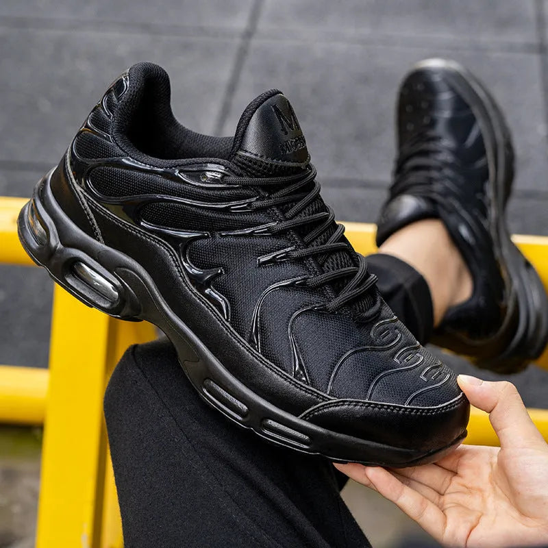 Black leather low-top safety sneakers with non-slip outsole, anti-smash and anti-scratch protection, available in sizes 41-47.