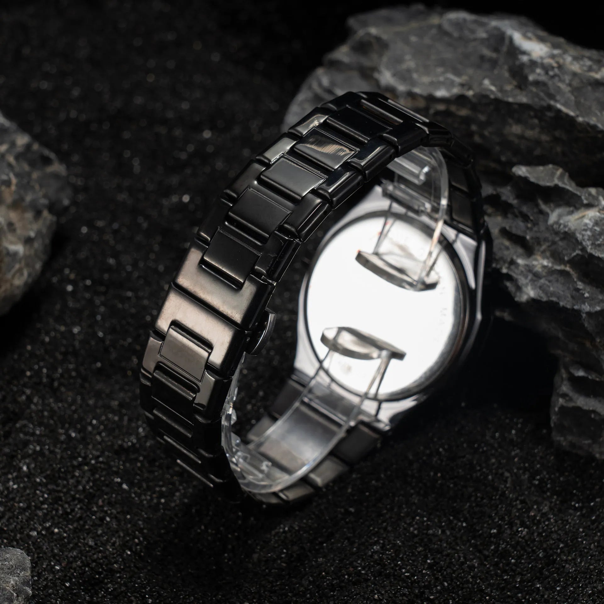 Men's business casual watch with steel bracelet showing black dial and silver scales