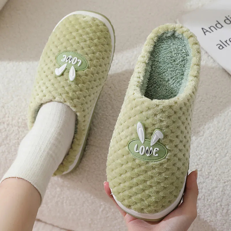 Women's rabbit plaid patterned artificial fur slippers with a thick sole and non-slip rubber base.