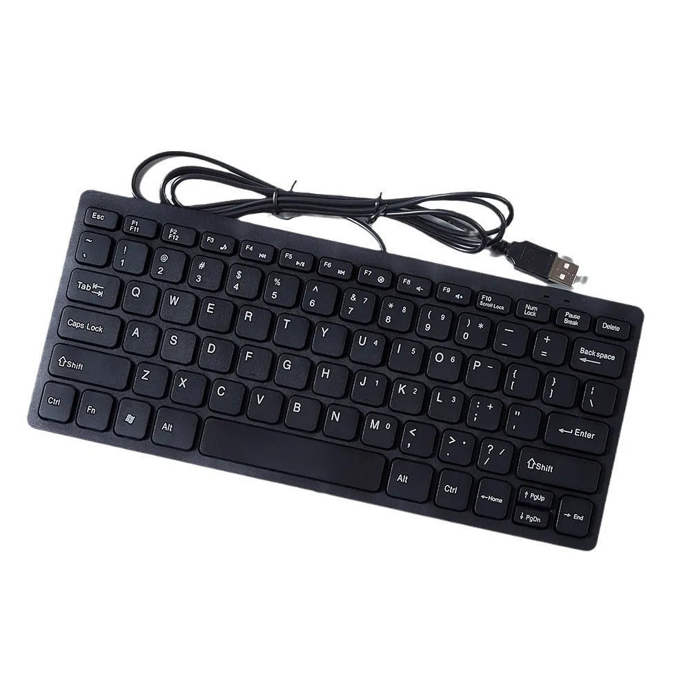 USB wired mini computer keyboard in black, white, pink, or blue colour on a desk.