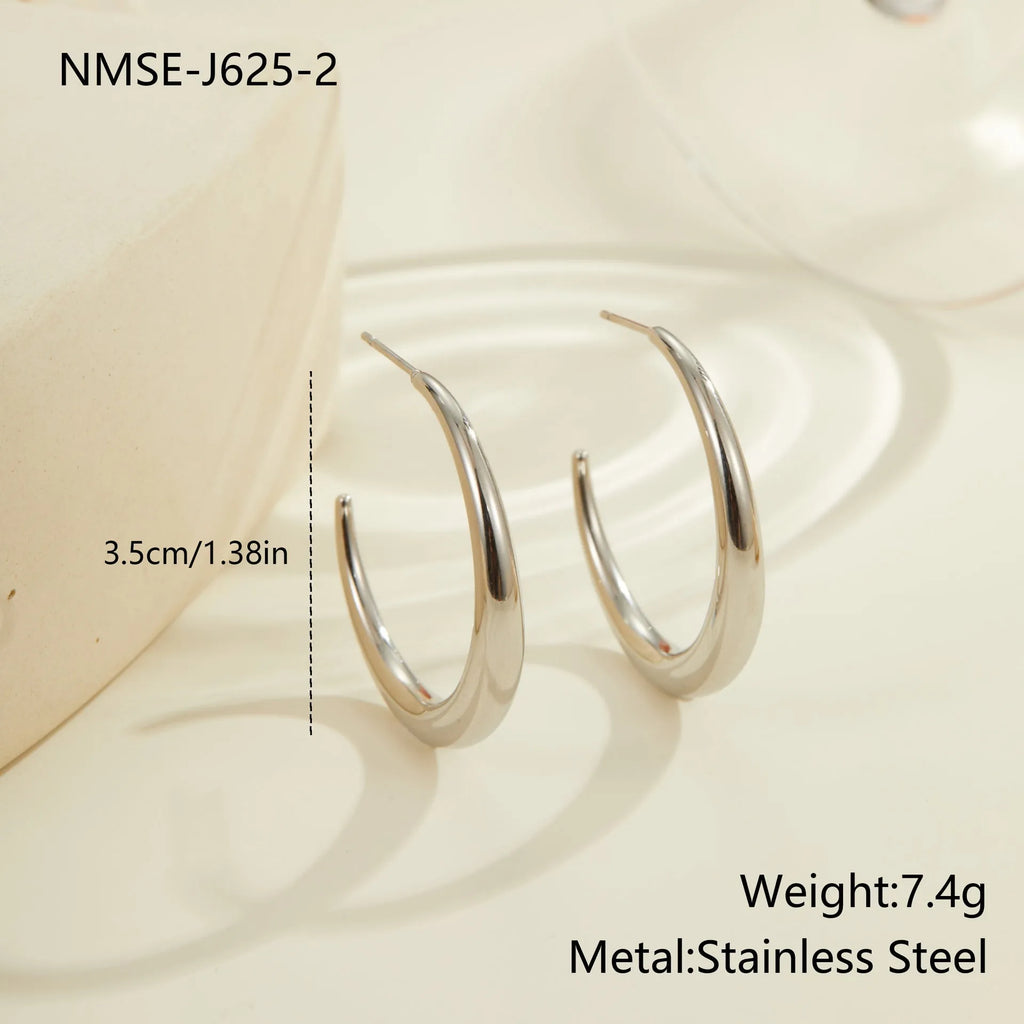 Titanium steel hoop earrings with 18K gold plating in geometric round design