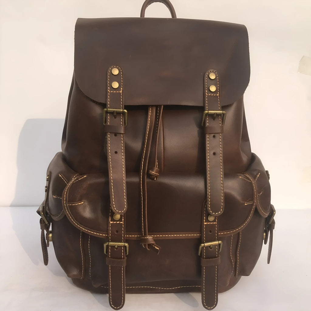 Brown men's leather backpack made from top-layer cowhide with an air pillow belt back system.