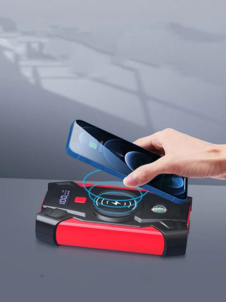 Red 12V car battery jump starter power pack with digital display and heavy-duty crocodile clips