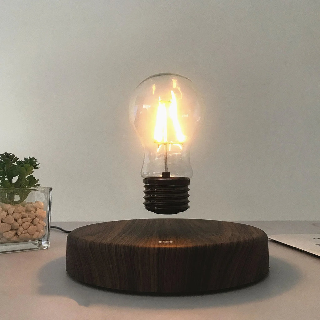 Magnetic levitation bulb night light floating above wooden base