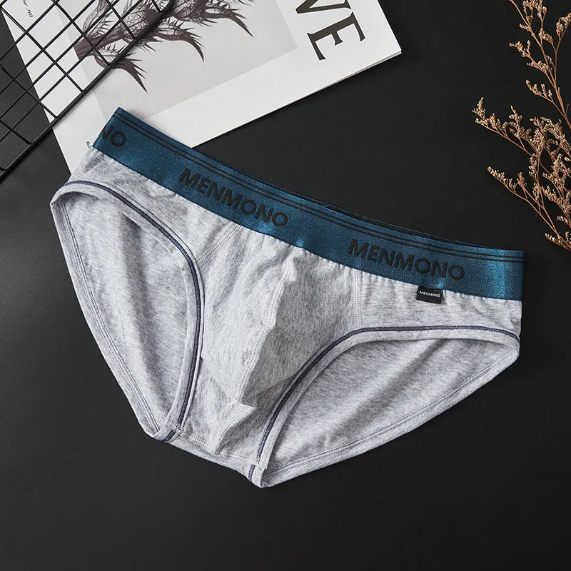 Men's low waist cotton briefs in a solid colour with contrast trim, shown in one of nine available colour combinations.