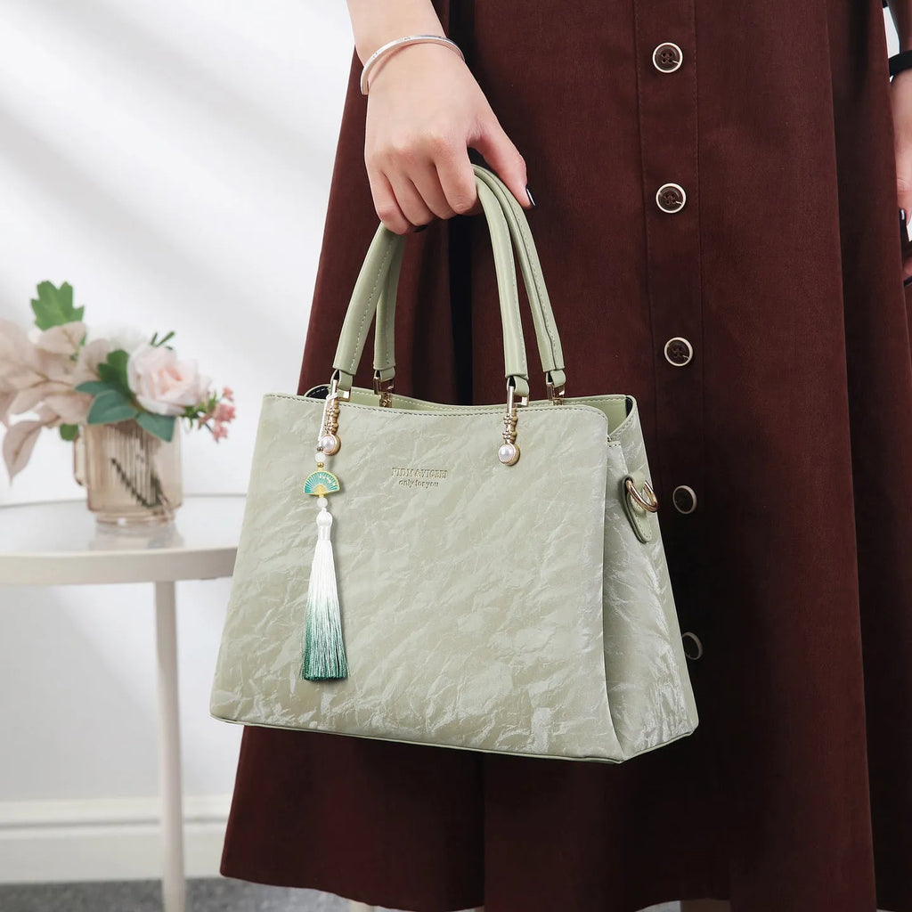 Women's PU shoulder bag in horizontal square shape with slit pocket, available in beige, black, green or red ethnic colours