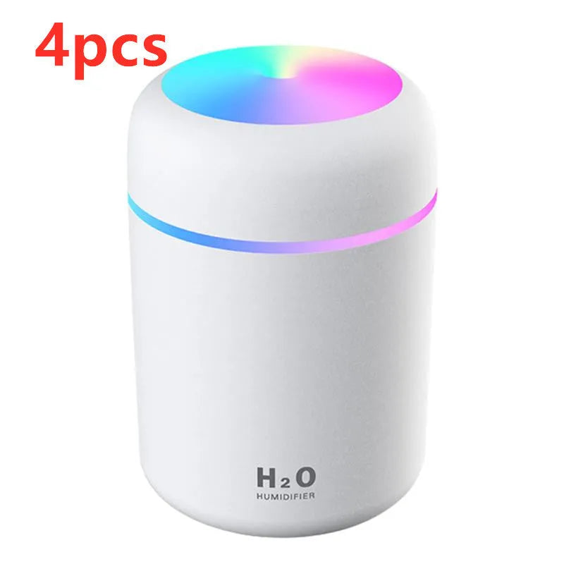Pink USB desktop humidifier with colourful lights and water mist output