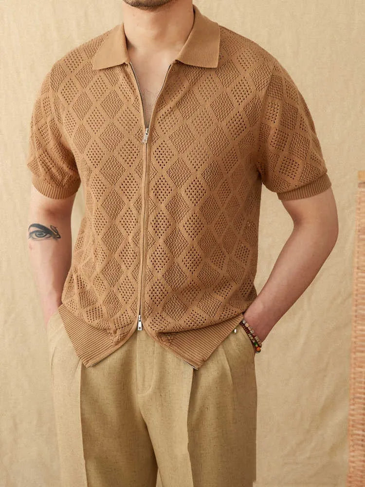 Light brown cotton short sleeve cardigan with zipper front and lapel collar on a hanger.