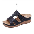 Women's red peep toe wedge sandals with a velcro strap closure on a fish mouth hollow wedge heel.