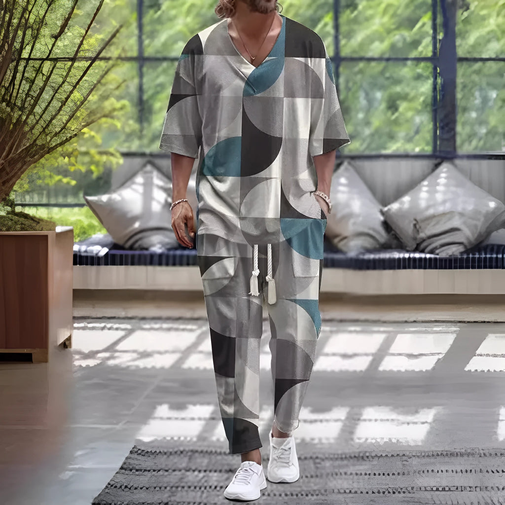 Cropped sleeve V-neck jacket and matching trousers suit on a hanger.