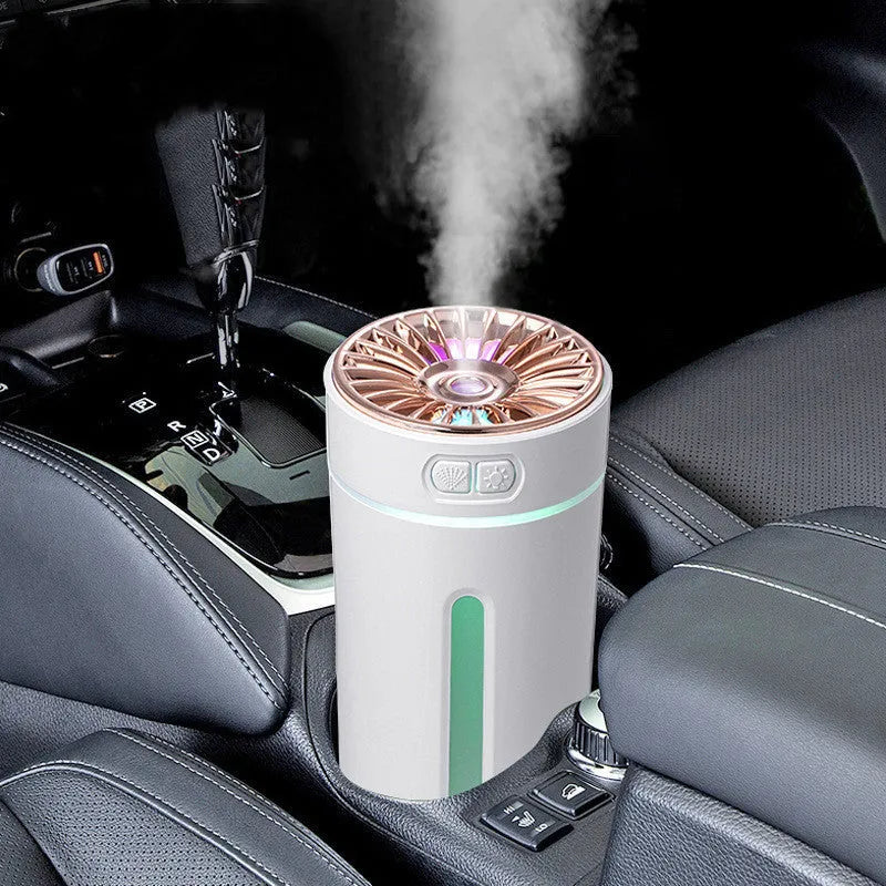 Black USB rechargeable car humidifier with colourful lights showing mist output, sized for cup holders