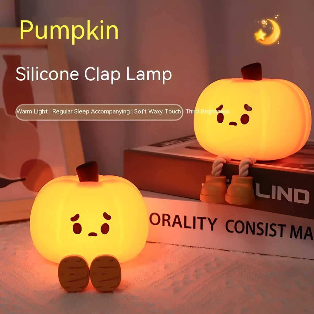Orange silicone pumpkin-shaped night light with USB charging cable