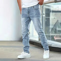 A pair of men's solid colour stretch jeans in a straight leg skinny fit, shown in dark blue.