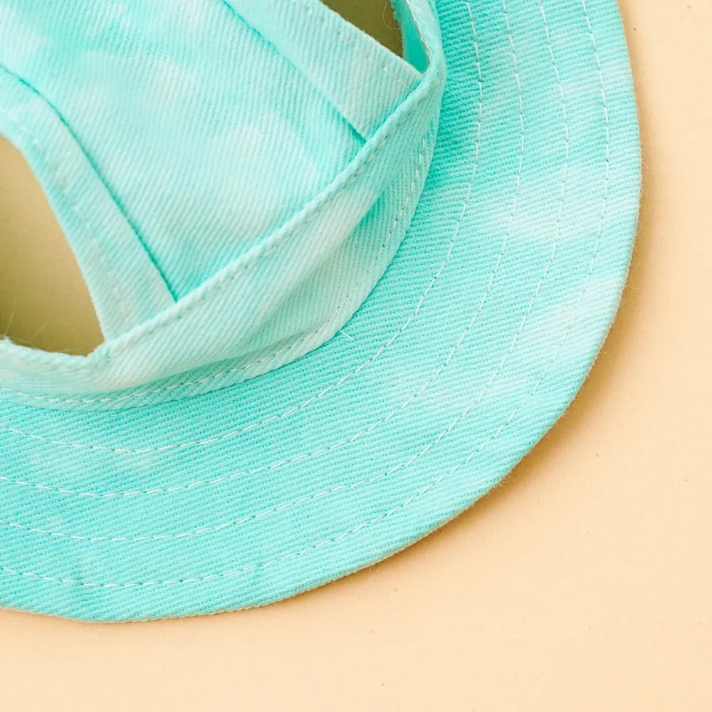Tie dye polyester sun protection bucket hat with adjustable string clip for pets, shown in colour option