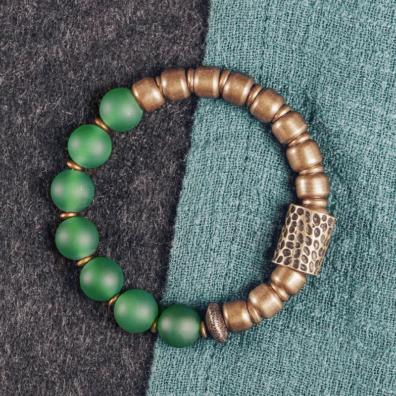 Retro ethnic style couples bracelet made of natural green and red agate beads on a string.