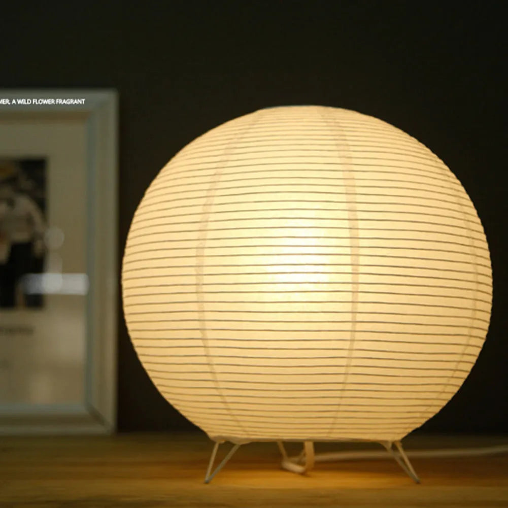 White rice paper plug-in table lamp with E14 bulb socket on wooden desk