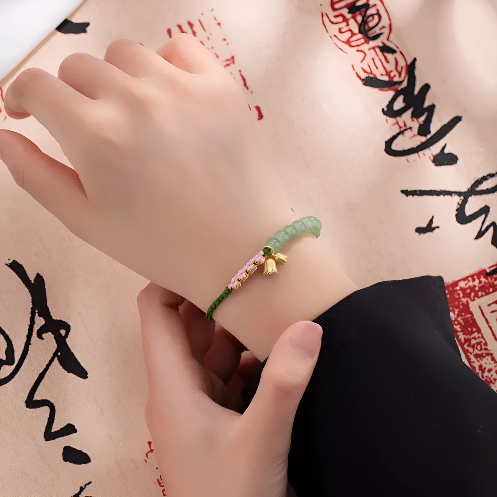 Hand woven red rope bracelet for women with lily carrying strap design and flower pattern