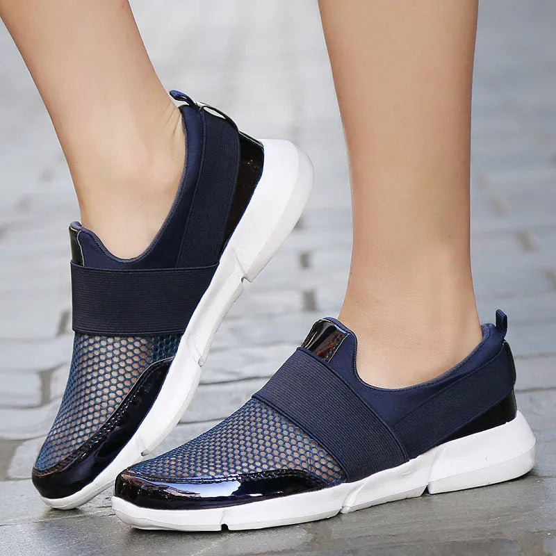 Blue, black, and grey women's low-top sneakers with mesh detailing and a PU midsole.