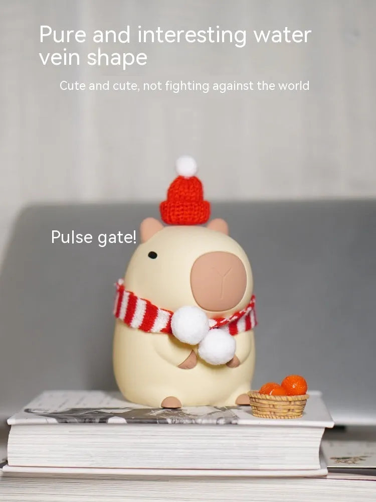 Cute capybara-shaped small night lamp on a table, showing its size and design.