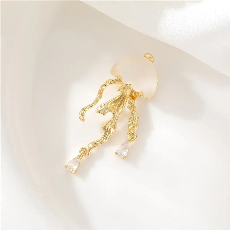 18K gold titanium steel openwork jellyfish pendant on silver O-ring chain against white background
