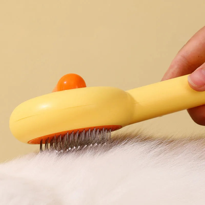 Small yellow duck comb for pet grooming with needle teeth and open section design